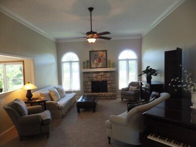 Great Room features lovely stone fireplace & ceili