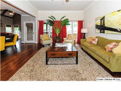Great room opens to the foyer and the kitchen.