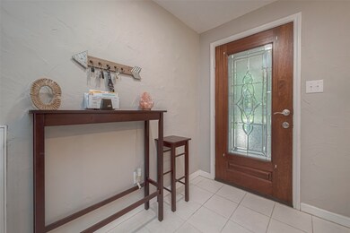 As you step inside, you'll be greeted by an inviting foyer that leads you into the heart of the home.
