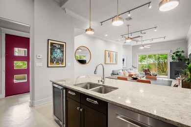 Kitchen featuring crown molding, concrete floorin