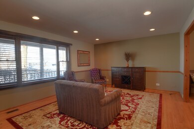 Main floor living room with oak hardwood floor, ch