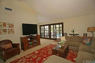 Living room features sliding French doors to beaut