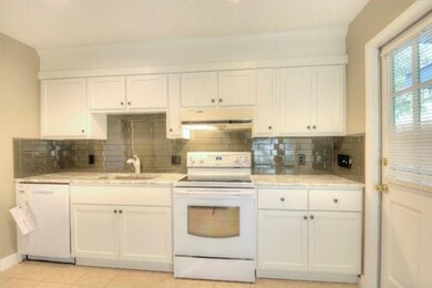 Newer kitchen with glass backsplash