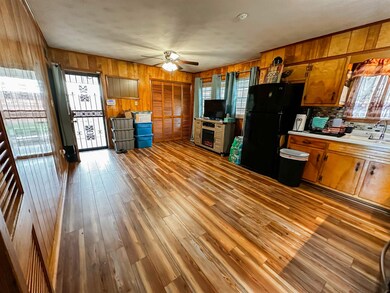 Kitchen with hardwood / wood-style flooring, ceili
