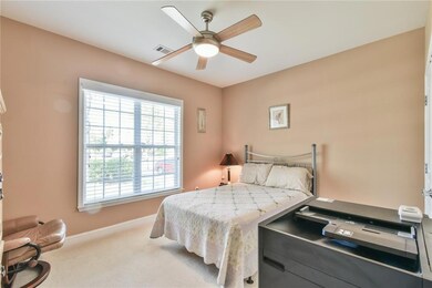 Bedroom featuring visible vents, carpet flooring, 