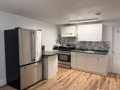 Kitchen with stainless steel appliances, and Gas Range