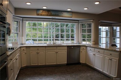 Renovated white bright kitchen w/ granite counters