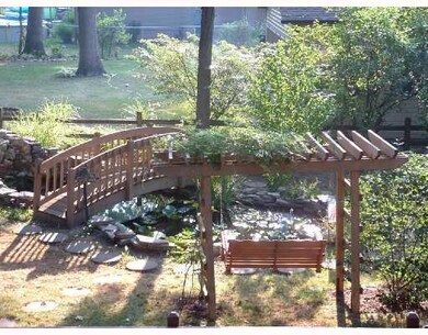 Exterior Front. Beautiful gold fish pond