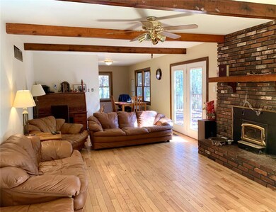 Large family room with french doors to deck, and w