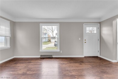 Foyer entrance with dark hardwood / wood-style flooring
