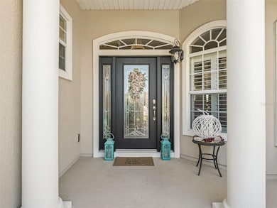Covered front entrance w/Elegant leaded glass door