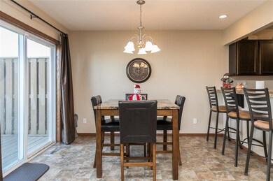 DINING AREA WITH VINYL SLIDER TO DECK WITH STAIRS 