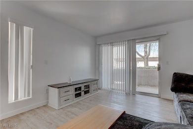 Living room featuring light wood finished floors a