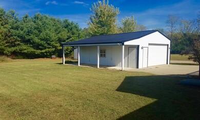 garage has 8x30 lean-to on side and spacious backyard