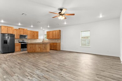 Kitchen featuring a healthy amount of sunlight, v