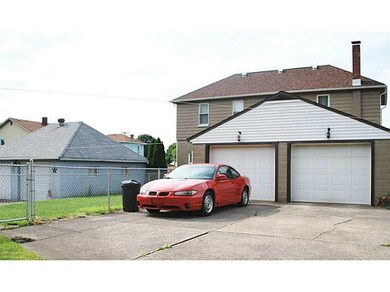 Parking Lot/Garage. Cement driveway leads to 2-car