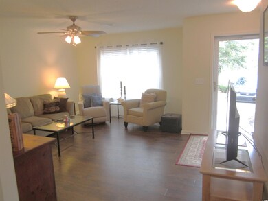 Living room featuring a wealth of natural light, c