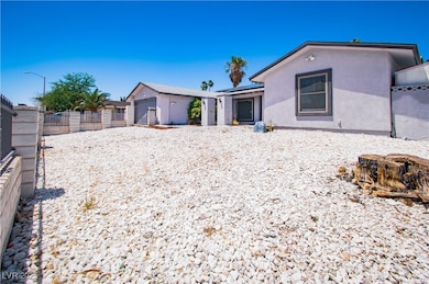 Back of house featuring stucco siding