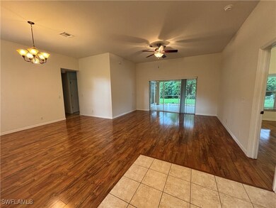 Empty room featuring wood finished floors, ceiling