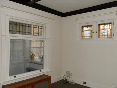 Living Room View of Sun Room & Western Facing Stai