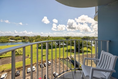 View from primary bedroom lanai looking across Wailoa state park towards the mountains.
