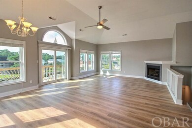 Grand Room with Gas Fireplace and Top Deck Access.