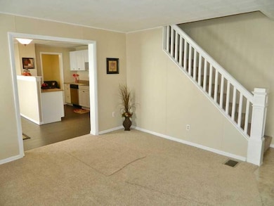 Living Room. New carpet throughout the home.