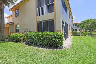 View of side of home featuring stucco siding and a lawn