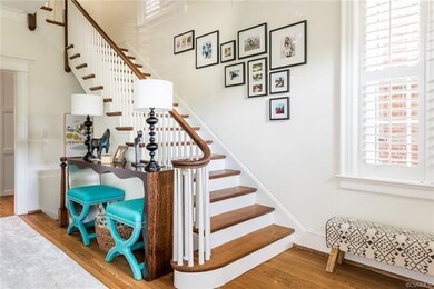 Spacious foyer and wide staircase leads to more exciting spaces above. Light floods the front hall with a southern exposure.