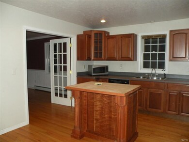 Kitchen with French door leading into the formal d