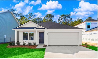 View of front of property featuring a garage, concrete driveway, and a front lawn