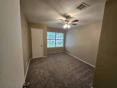 Unfurnished room with a textured ceiling, visible