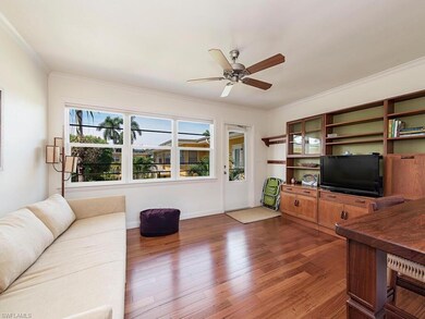 Living Room with Door to Balcony and Courtyard.