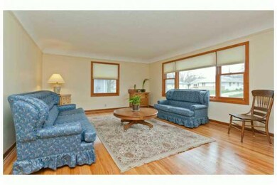 Living Room. Newer Pella windows throughout the home (only ones not replaced are west master bedroom windows and kitchen).  Gleaming hardwood floors throughout living room, hall, dining area, kitchen and 3 of the bedrooms.