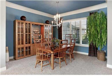 Formal dining area with window overlooking front o