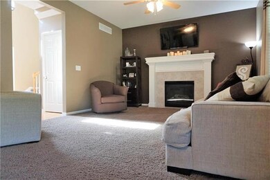 Large Great room with Fireplace and 3 Big Windows.