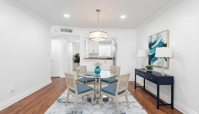 Dining area leading to kitchen spacious enough for 6 person table - Virtually Staged