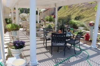 Lovely covered side patio off the dining area