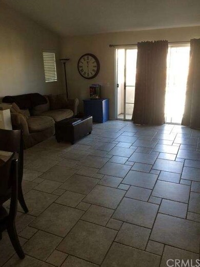 Living room, showing sliding door to balcony.