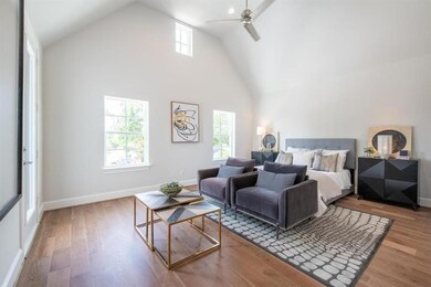 Primary Bedroom with tall ceilings and a balcony t