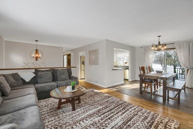 View of main level! Separate dining area and kitchen just beyond. Views of the fenced in backyard from the patio door.