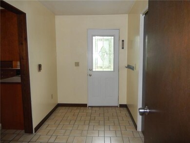 Foyer big enough for shoes and coats.