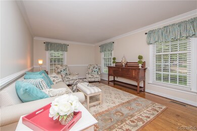 Living Room with pine floors, crown and chair rail