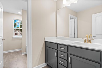 Bathroom featuring vanity and tile patterned floor