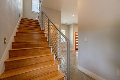 Staircase featuring recessed lighting and concret