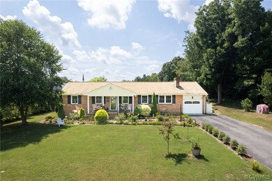 Single story home featuring a garage and a front l