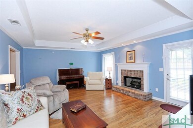 Gorgeous family room with gas logs in the masonry 