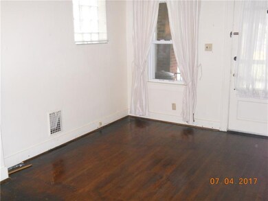 Large bright living room with windows looking onto
