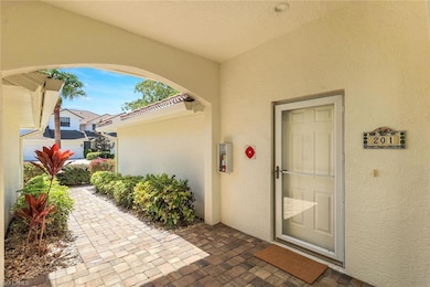 Entrance to property with stucco siding