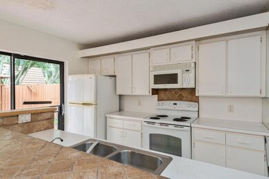 Kitchen area with separate exit to patio